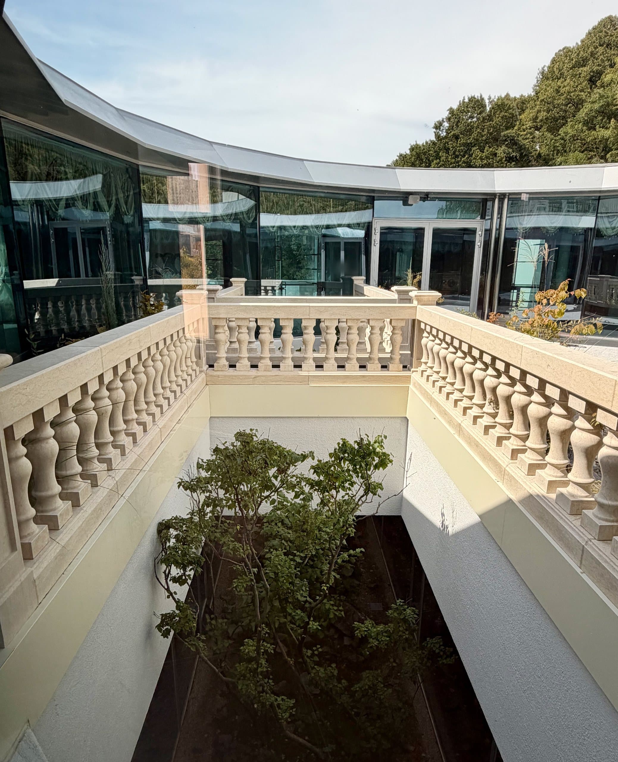 Stone balustrades around a planted lightwell